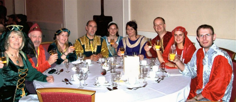 Picture of members making a toast in their Robin Hood dress. Picture of members making a toast in their Robin Hood dress.