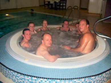 Picture of a group enjoying a dip in a jacuzzi. Picture of a group enjoying a dip in a jacuzzi.