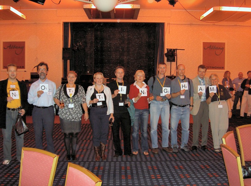 Picture of members holding oversize scrabble tiles spelling 'Nottingham'. Picture of members holding oversize scrabble tiles spelling 'Nottingham'.