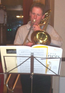 Picture of Alan playing the trombone. Picture of Alan playing the trombone.