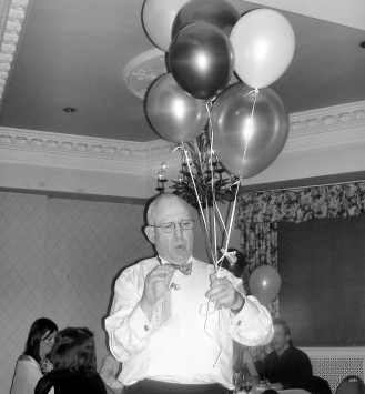 Picture from the Winter Ball of someone holding six helium filled ballons. Picture from the Winter Ball of someone holding six helium filled ballons.
