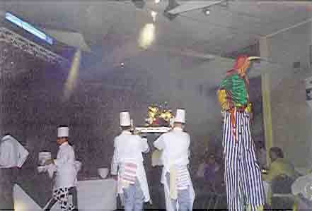 Picture of chefs grandly carrying in the food. Picture of chefs grandly carrying in the food.