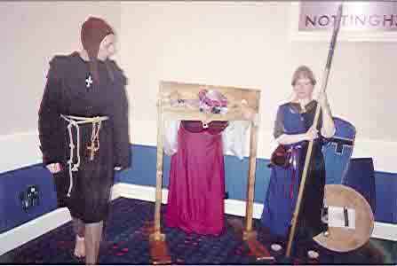 Picture of an attendee in the stocks. Picture of an attendee in the stocks.