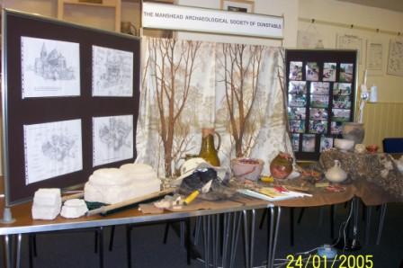 Picture of a display of archaeological material with the society banner as backdrop Picture of a display of archaeological material with the society banner as backdrop