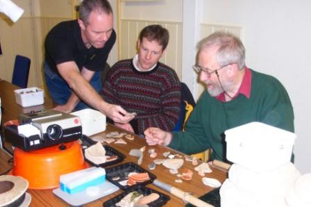 Picture of members study an array of material Picture of members study an array of material