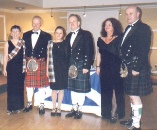 Picture of members in their tartan attire Picture of members in their tartan attire