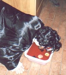 Picture of a dracula bobbing for apples floating in a blood red liquid Picture of a dracula bobbing for apples floating in a blood red liquid