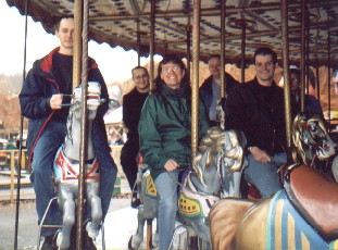 Picture of riders on a fairground carousel Picture of riders on a fairground carousel
