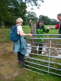 Picture of the group negotiating a muddy gate Picture of the group negotiating a muddy gate