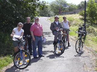 Picture of members on a rest stop along their cycle ride Picture of members on a rest stop along their cycle ride