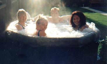 Picture of guests enjoying a dip in the hot tub. Picture of guests enjoying a dip in the hot tub.
