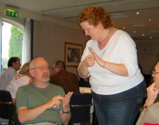 Picture of two of the group trying some more sign language Picture of two of the group trying some more sign language