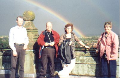 Picture of a members on Southwell Minster roof with a double rainbow behind them Picture of a members on Southwell Minster roof with a double rainbow behind them