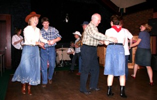 Another picture of the group square dancing Another picture of the group square dancing