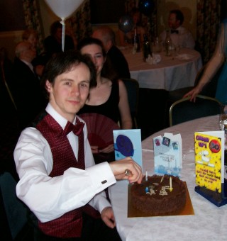 Picture of Iain Benson cutting his birthday cake. Picture of Iain Benson cutting his birthday cake.