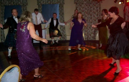 Picture of members dancing the twist. Picture of members dancing the twist.