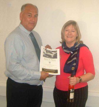 Picture of presentation to Trish Kennett
