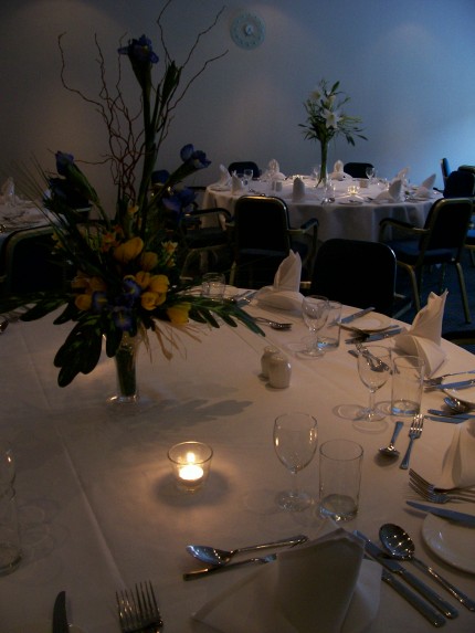 The dining room was set elegantly set out with table candles lighting up the centre piece flower decorations and silverware. The dining room was set elegantly set out with table candles lighting up the centre piece flower decorations and silverware.